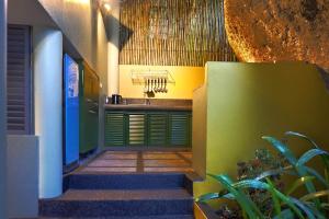 a hallway of a house with stairs leading to a kitchen at Villa Sapphire in Laem Set Beach