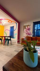 a living room with a couch and a table at Casa Pinturella in Silver Spring