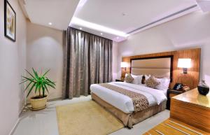 Ένα ή περισσότερα κρεβάτια σε δωμάτιο στο Auris Al Fanar Suites