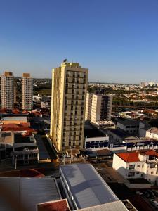 an aerial view of a city with tall buildings at Apto Moderno no Centro - Completo e Confortável in Americana