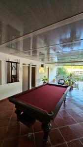 a pool table in the middle of a room at Finca los Bohíos in Santa Rosa de Cabal