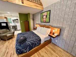 a bedroom with a bed and a wall at Great Cabin In Close To Walking Trails And Beaches - 13T in Ucluelet