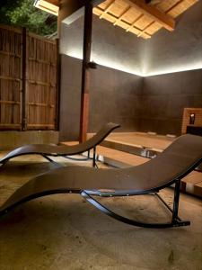 two chairs in a room with a skateboard ramp at TIMeSCAPE -hakone- in Miyanoshita