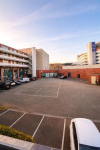 an empty parking lot in front of a building at Casaejon in Lelystad