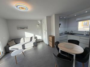 a living room with a couch and a table at Apartment A&T La Mata in La Mata