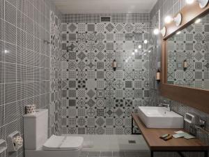 a bathroom with a white toilet and a sink at Mercure Hotel President Lecce in Lecce +112 photos