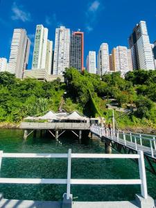 a bridge over a body of water with a city at Vitória Marina Flats in Salvador