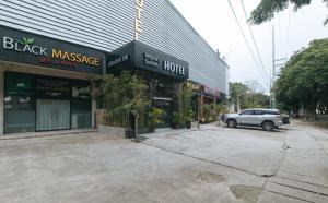 a car is parked in front of a building at Regency Sunset Condotel in Angeles