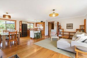 a living room and kitchen with a couch and a table at Blue Moon in Beechworth +14 photos