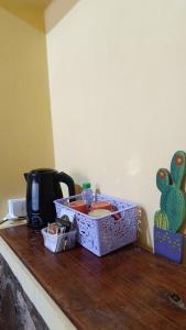 a box on top of a counter with a coffee maker at El MasSi in Tilcara