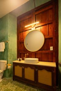 a bathroom with a sink and a mirror at Dos Almas Casa Boutique in Campeche +15 photos