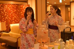 two women in kimonos eating food at a table at Shimobe Hotel in Minobu +56 photos
