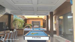 a pool table in the middle of a room at Osaka Villa Phan Thiet in Ấp Bình Hưng
