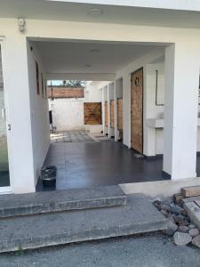 an empty hallway of a house with a door at Beekind in San Juan Teotihuacán +1 photo