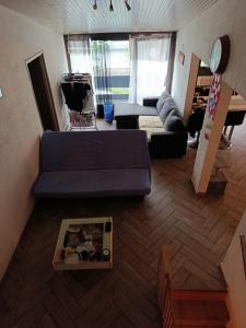 an overhead view of a living room with a blue couch at Duplex 95m2 Annecy in Annecy