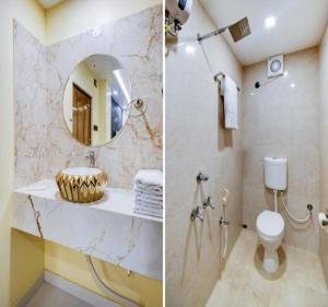a bathroom with a sink and a toilet and a mirror at Hotel Morya Suites IGI Airport in New Delhi