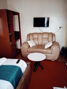 a living room with a couch and a table at Jipso homes in Eldoret