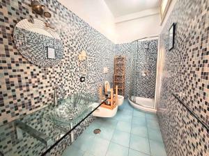 a bathroom with a shower and a sink and a mirror at Casa Evelina in Sant'Agnello +39 photos