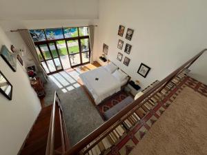 an overhead view of a bedroom with a bed at Tree Roots Retreat in Rayong