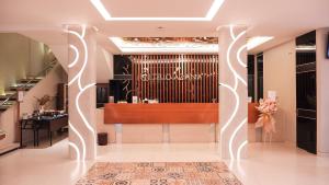 a lobby with a organ in a building at Trio Azana Resort Magelang in Magelang