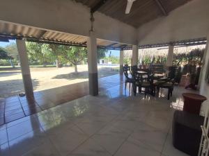 a patio with a table and chairs on it at Finca # 20 - Arjona in Turbaco