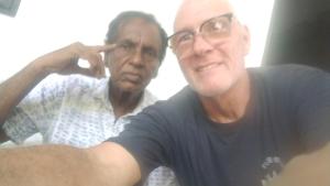 an older man helping another man get his haircut at ADOBE AFFECTIOn in Tangalle