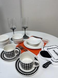 a table with plates and cups and glasses on it at Hi Seoul Gongdeok 2 in Seoul