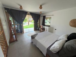 a bedroom with a bed and a desk in it at Casa ysatis in Lazi