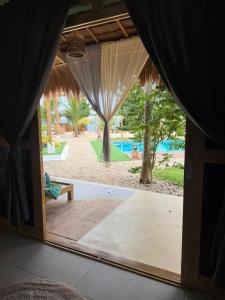 a door to a patio with a view of a pool at Casa ysatis in Lazi