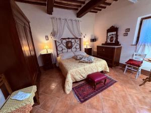 a bedroom with a bed and a dresser at B&B Il Pettirosso di Siena in Siena +43 photos
