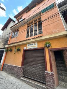 a building with two garage doors in front of it at Casa fide cómoda in Panajachel