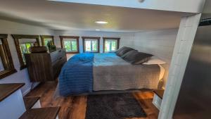 a bedroom in a tiny house with a bed at The Sundance Tiny Home in Pauma Valley +35 photos