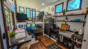 a kitchen and living room in a tiny house at The Sundance Tiny Home in Pauma Valley