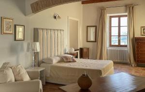 a bedroom with a bed and a living room at Az Ag Ricciarelli N in San Giuliano di Puglia