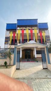 a building with flags on the front of it at Hotel Kunj Palace in Habibnagar