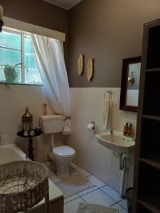 a bathroom with a toilet and a sink at Bowden B&B in Olifantshoek +42 photos