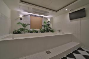 a bathroom with a sink and a mirror at 그랑메종 바오밥 호텔 in Gwangju +70 photos