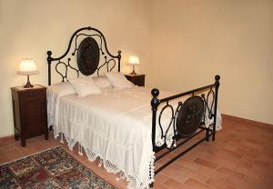 A bed or beds in a room at I Grandi Di Toscana
