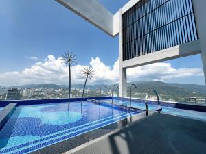 a large swimming pool on top of a building at Le Arch Suite - Georgetown Komtar View Studio in George Town