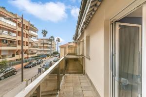 a balcony with a view of a city street at Clementines 50 Meters From Sea - Happy Rentals in Roquebrune-Cap-Martin