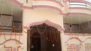 a building with a front door with christmas decorations at Home in Lucknow
