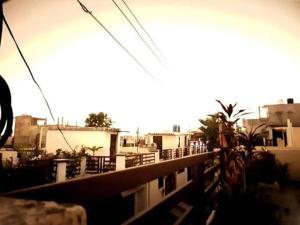 a view of a city with buildings in the background at Home in Lucknow