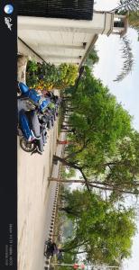 a row of motorcycles parked on the side of a building at The grand regency in Rāmpur