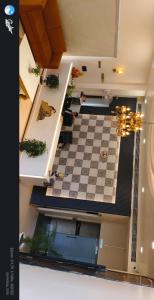 a view of a room with a checkered floor at The grand regency in Rāmpur