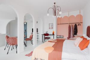 a bedroom with a bed and a dining room at Pine & Cedar Suites – Hua Xiao Ye in Shanghai