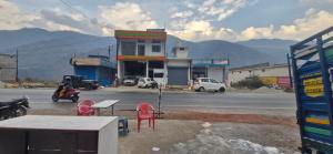 a gas station on the side of a road at Hotel Royal galaxy in Dharāsu +2 photos