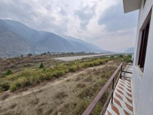 a view of a road from a balcony of a house at Hotel Royal galaxy in Dharāsu