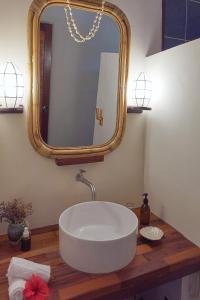 a bathroom with a large mirror and a sink at Surfista Villa Siargao in General Luna +17 photos