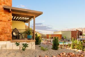 a building with a balcony with a pool at Hyatt Place Moab in Moab