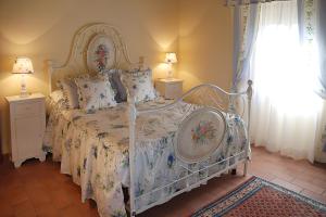 A bed or beds in a room at I Grandi Di Toscana